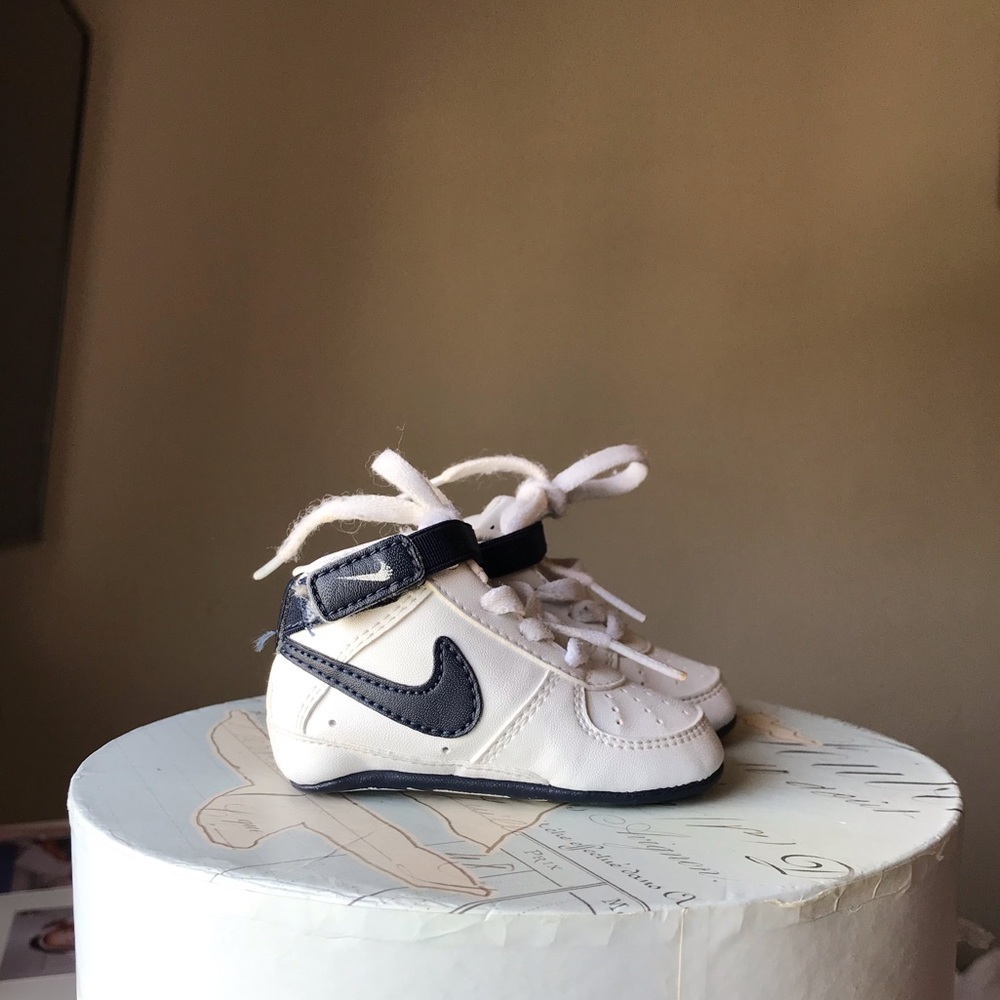 Baby boy’s white Nike shoes